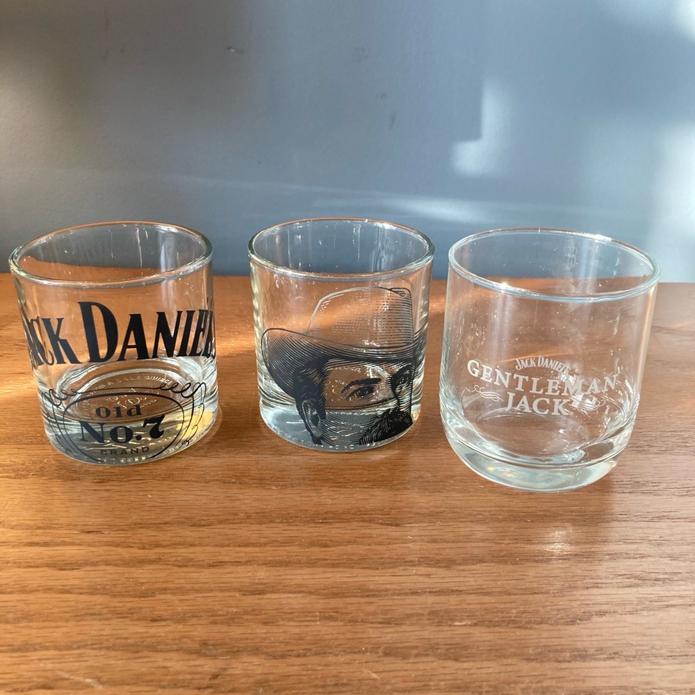 3 Jack Daniels, whiskey, rocks glasses.